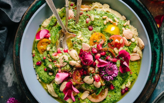 A pesto mixture with nuts and flowers.